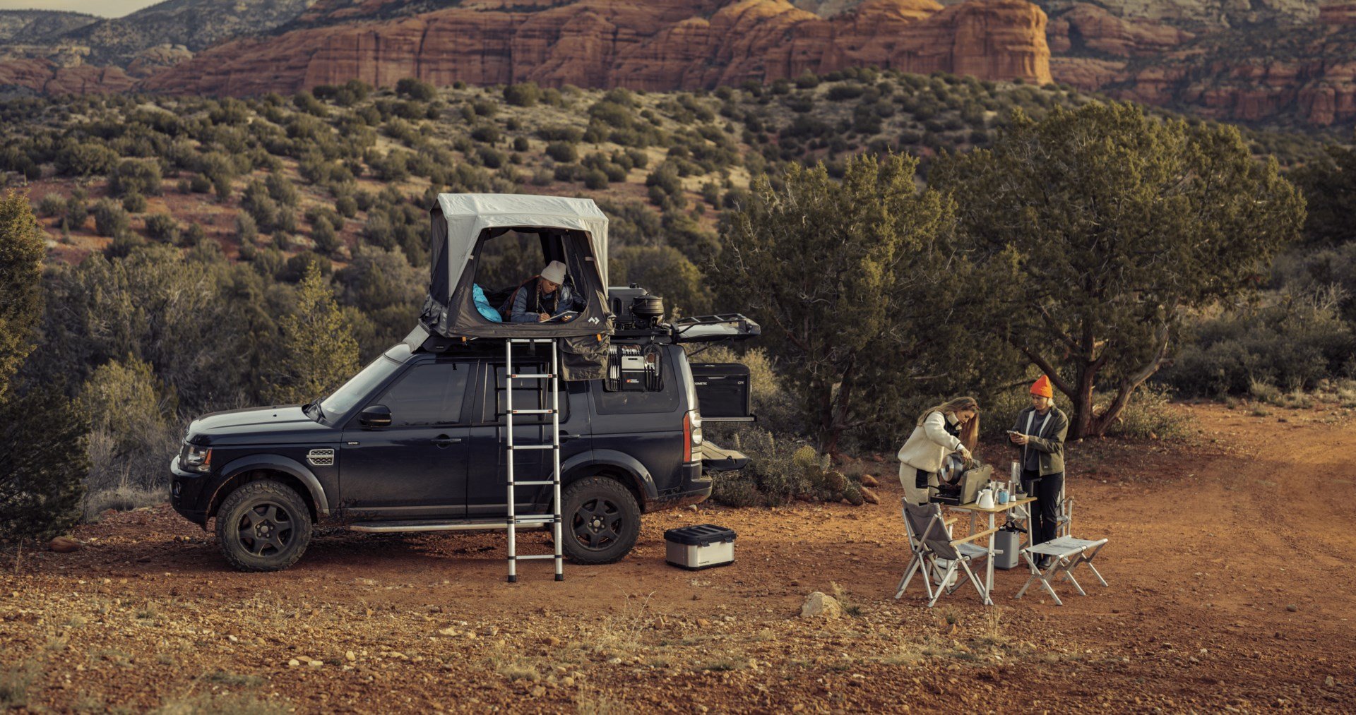 Cars on a dusty road with Dometic rooftop tent